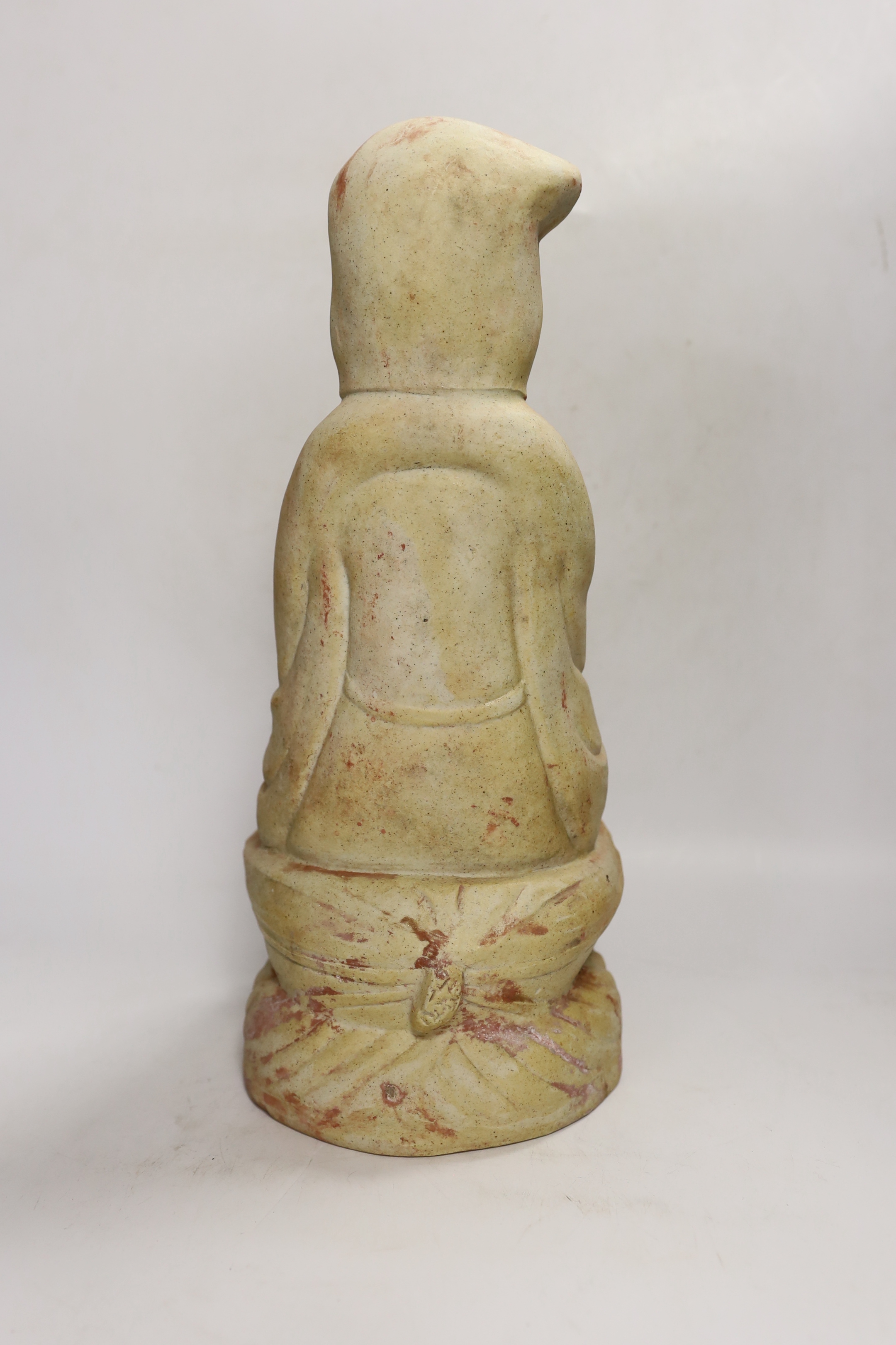 A Chinese biscuit figure of Guanyin, 38cm high